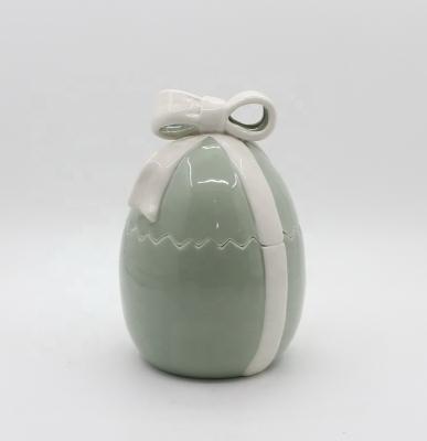 China Contemporary Promotional Hot Sale Green Canister Ceramic Easter Egg With Ribbons for sale