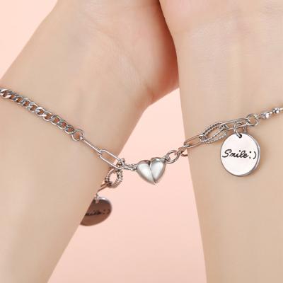 China Hot Selling Punk Gift Silver Heart Shape Magnet Stainless Steel Memorial Couples Bracelet With Smile Pendant for sale