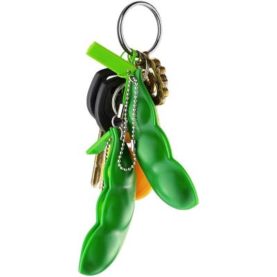 China New Design Novelty Stirring Person Toy Soybean Stress Relieving Bean Toy Funny Facial Expression Bean Keychain for sale