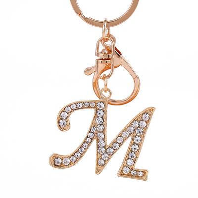 China Popular Custom Hot Sale Rose Design 26 Initial Letter Gold Artist Key Chain With Bling CZ for sale