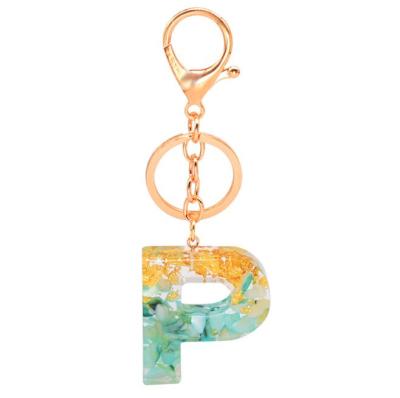 China Hot Sale Plastic A-Z Charm Letter Green Color Gold Leaf Amazon Alphabet Resin Key Chain Initial Gold/Silver Key Chain for sale