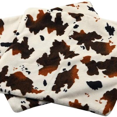 China Coral anti pill knitted polyester fleece fabric rolls hometextile brown cow print super soft double sides for blanket for sale