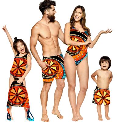 China QUICK DRY Home Swimwear Solutions Men Short Set Women Matching Swimwear Swimwear Dasgiki African Pink/Green/Yellow Print Pattern Family for sale