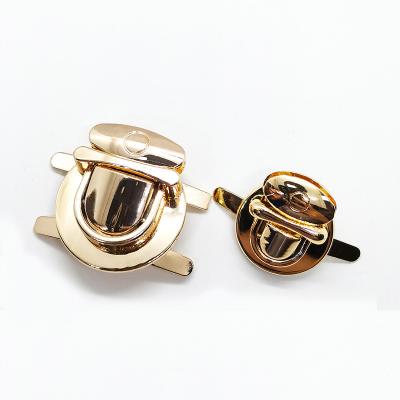 China Sweet Hot Sales Catch Purse Thumb Lock Buckle Fasteners Wallet Buckle Metal Tuck Lock Clasp for sale