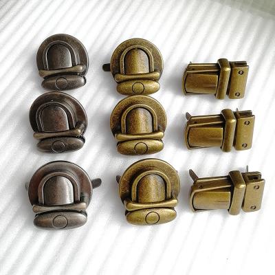 China Heart Shape Metal Tuck Lock Clasp Towel Fasteners Buckle Wallet Hook Purse Smooth Thumb Lock for sale