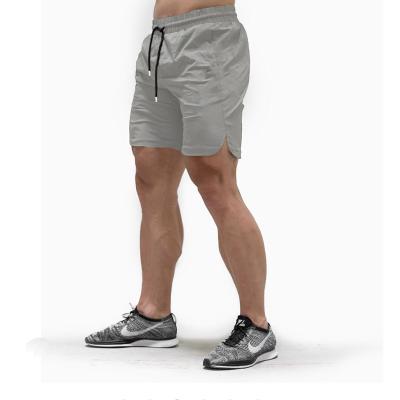 China Anti-wrinkle men's stretch sports pants leisure fitness two-in-one quick-drying nine-point shorts for sale