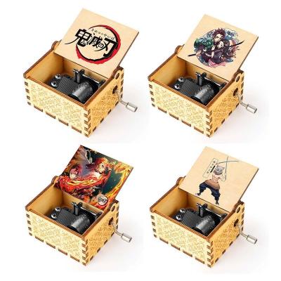 China 42 Metal Designs Melody Hand Crank Laser Engraved Anime Demon Slayer Wooden Music Box for sale