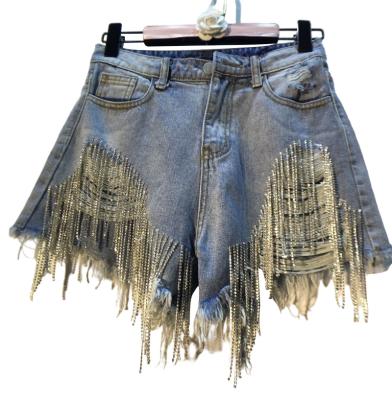 China Anti-wrinkle summer high waist slimming beaded diamond fringed jeans tassel denim ripped shorts for women for sale