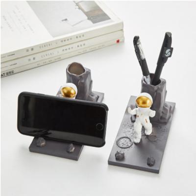 China China Creative Nordic Astronaut Pen Holder Mobile Phone Bracket Multifunctional Resin Crafts for sale