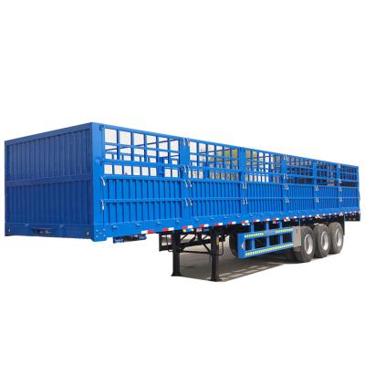 China Truck Trailer Dry Cargo Carrier Sidewall Trailer Flatbed Trailer With Grill 3 Axles Cargo Barrier Semi Trailer for sale