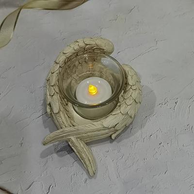 China Europe Home Decorations Resin Wing LED Candles Polyresin Wing Tea Light Electronic Candle Holder for sale