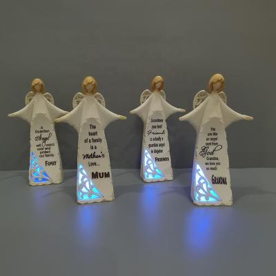 China Europe Home Decorations Polyresin Light Up Resin Angel Wings Figurine Lighted Wings Angel Figurine for sale