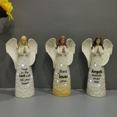 China Europe Factory Direct Selling Polyresin Light Praying Angel Figurine Lighted Resin Wings Angel for sale