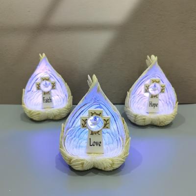 China Europe Home Decorations Resin Wing Nativity Cross FAITH/LOVE/HOPE Light Up Wing Nativity Scene Figurine for sale