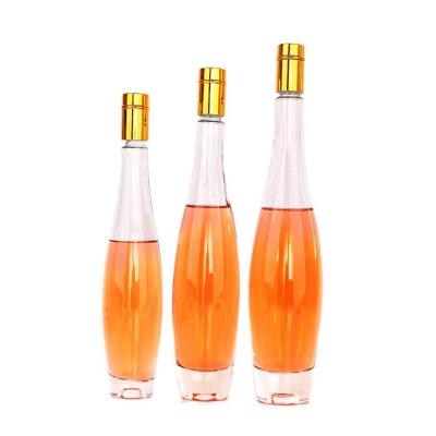 China Fashionable 275ml 375ml 500ml fancy empty glass bottle around whiskey brandy for sale