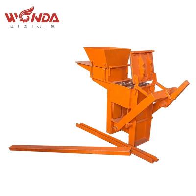 China Garment Shops Manual Hand Press Earth Brick Machine Compressed Earth Brick Making Machine Interlocking for sale