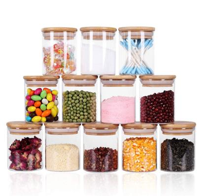 China Heatable Glass Jar Wooden Round Good Price Airtight Transparent Food Storage Containers Glass Bottle for sale