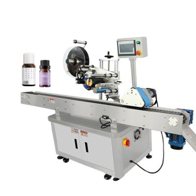 China Automatic Horizontal Round Bottle Labeling Machine Top Label Applicator Machine Product Labels For Cosmetic Bottle en venta