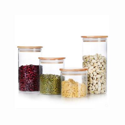 China Borosilicate Heatable High Quality Clear Airtight Storage Glass Jar With Wooden Lid for sale