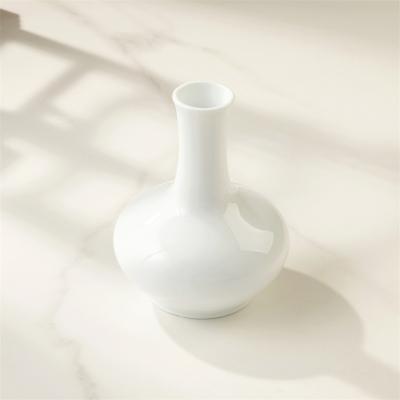 China Auratic Modern Wholesale Modern Design Round Ceramic Nordic Home Decoration White Tabletop Flower Vases for sale