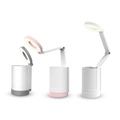 China Modern Eye Care Style LED Desk Lamp Battery Table Lamp Folding Desk Lamp with Pen Holder Phone Stand for sale