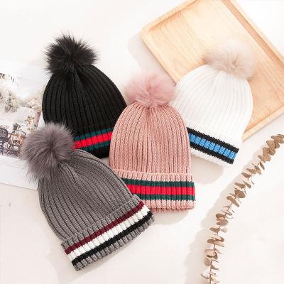 China Wholesale COMMON 2022 Winter Ski Beanie Hats With Acrylic Pom Pom Striped Knitted Custom Faux Fur Hats for sale