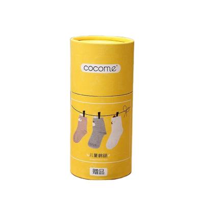 China Recyclable Yellow Printing Recycled Packing Round Cardboard Box For Kids Socks Tube for sale