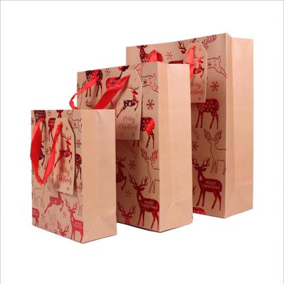 China New Recyclable Christmas Gift Paper Bag Printed White Card Paper Handbag for sale