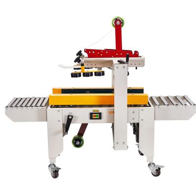 China Plastic Semi Automatic Food Adhesive Tape Cardboard Box Sealing Machine for sale