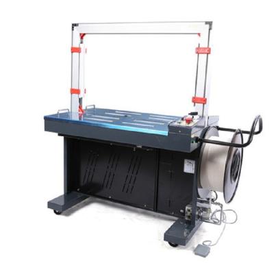 China Food Fully Autom pp Plastic Tie Up Band Belt Wrap Carton Box Tying Side Bottom Seal Automatic Rolls Paper Strapping Machines for sale