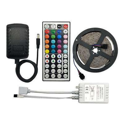 China Residential IP65 5m/roll waterproof 30leds/m 5050 RGB led strip light with remote controller with transformer for sale