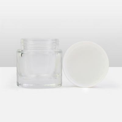 China Custom New Arrival 2oz Lid Child Thick Wide Mouth Packaging Resistant Bottom Expanding Glass Jars With CR Lid for sale