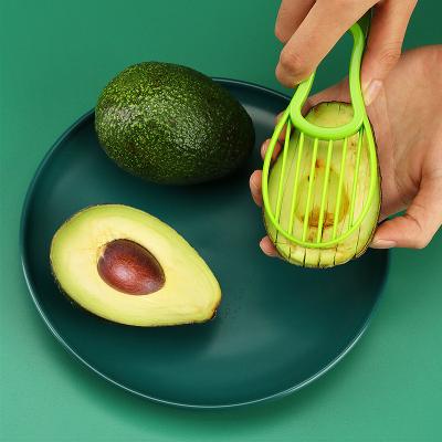 China 2023 Viable Food Grade Alicer 3 In 1 Hot Selling Pure Plastic Orange Color Green Color Avocado For Kitchen for sale