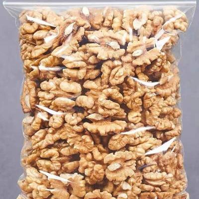 China Fresh Low Cost Raw Walnuts in Quarters and Pieces Gluten Free Certified Vegan and Organic for sale