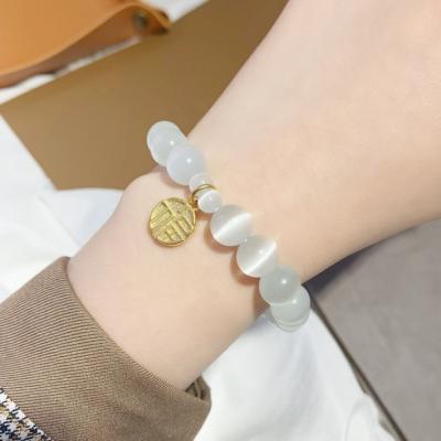 China FASHIONABLE net red the same gold opal dangling friend sand brand Blessing bracelet simple CSI cold wind bracelet for sale