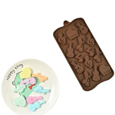 China Factory Stocked Customized 14 Hole Brown Non-Stick Food Grade Silicone Musical Instrument Chocolate Mold for sale