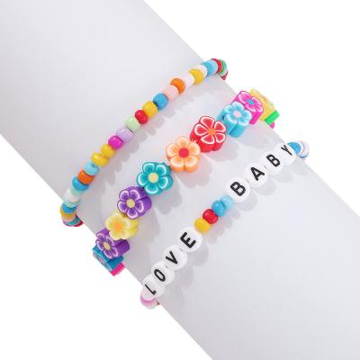 China New Hand BOHEMIA Decoration Bohemian Simple Design Soft Pottery Flower Beaded Letter Bracelet Set for sale