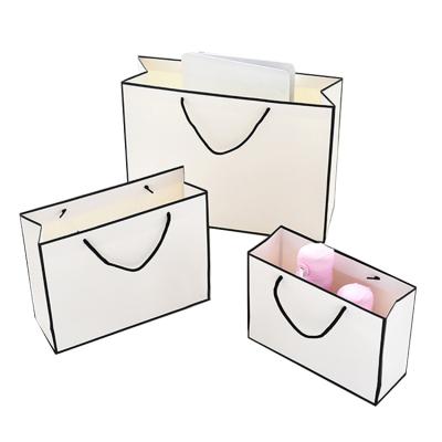 China Creative High Quality Customized Recyclable Craft Paper Bag With Silver Foil Stamping Flat Paper Handle For Gift for sale