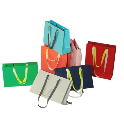 China Recyclable Colorful Custom Logo Craft Small Luxury Paper Bag Gift Bags for sale