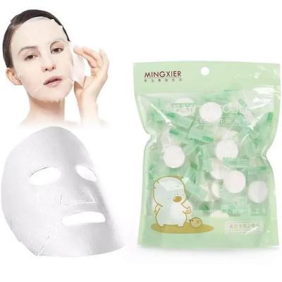 China Moisturizing cream a bag of 50 PCs of compressed cosmetic facial mask covers paper water replenishment packaging independent mask for sale