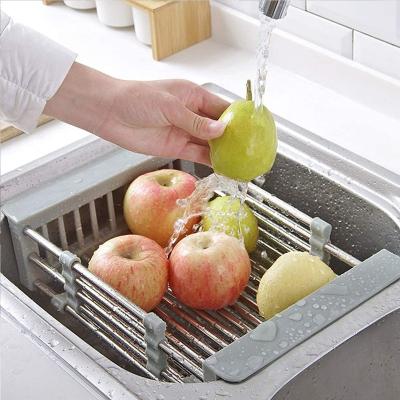 China The faucet stainless steel kitchen sink storage rack pop-up drain basket, being used for storing and drying kitchen sink items, fruit basket for sale