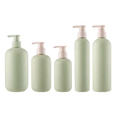 China Cosmetic Wholesale custom cosmetic plastic pump bottle 200ml 250ml 400ml 500ml green PET lotion pump bottle with white pump for sale