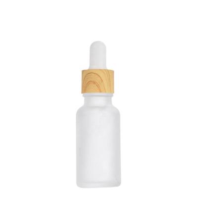 China Wishing Skin Care Cosmetics Dropper 10ml 15ml 30ml 50ml Frosting Glass Essential Oil Bottle Bamboo Cap Dropper Bottle 30m for sale