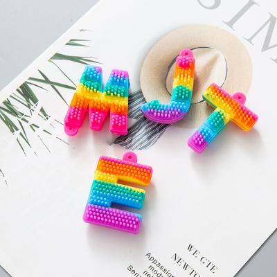 China Fashionable Hot Selling Creative Letter Shapes Rainbow Bubble Silicone Pop It Wiggle Key Chain for sale