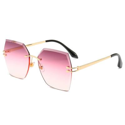 China Fashion Sunglasses Shape Sunglasses 2021 Diamond Cut Women Rimless Shades Slim Metal Frame Oversized Glass Lenses for sale