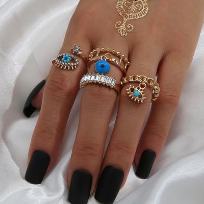 China Easy Set Fairy Fashion Accessories 4pcs Evil Eye Ring Punk Gold Plated For Woman Diamond Chain Oil Drip Evil Eye Rings Wholesale for sale