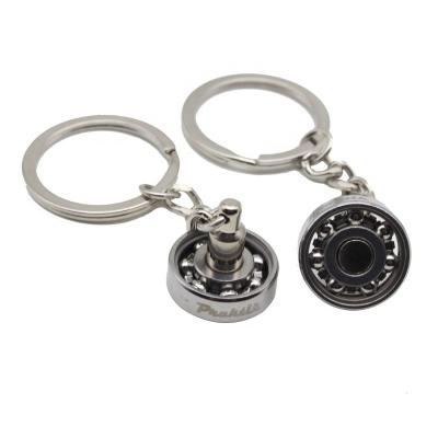 China Souvenir New Arrival 3d Stainless Steel Rolling Ball Swivel Key Chain Key Ring for sale