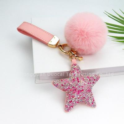 China New style designer keychains fashion tassel bag accessories women cute luxury animal fur car key chain leather key chain for sale