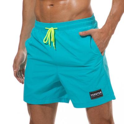 China Summer Anti-UV Men's Dropshipping Surf Solid Color Fashion Beach Shorts Scanties With Pocket for sale