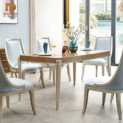 China Damoo Wood Leg LUXURY Modern Dining Table With Metal Glass Top Dining Set Modern Luxury Chandelier Brown Dining Table Set for sale